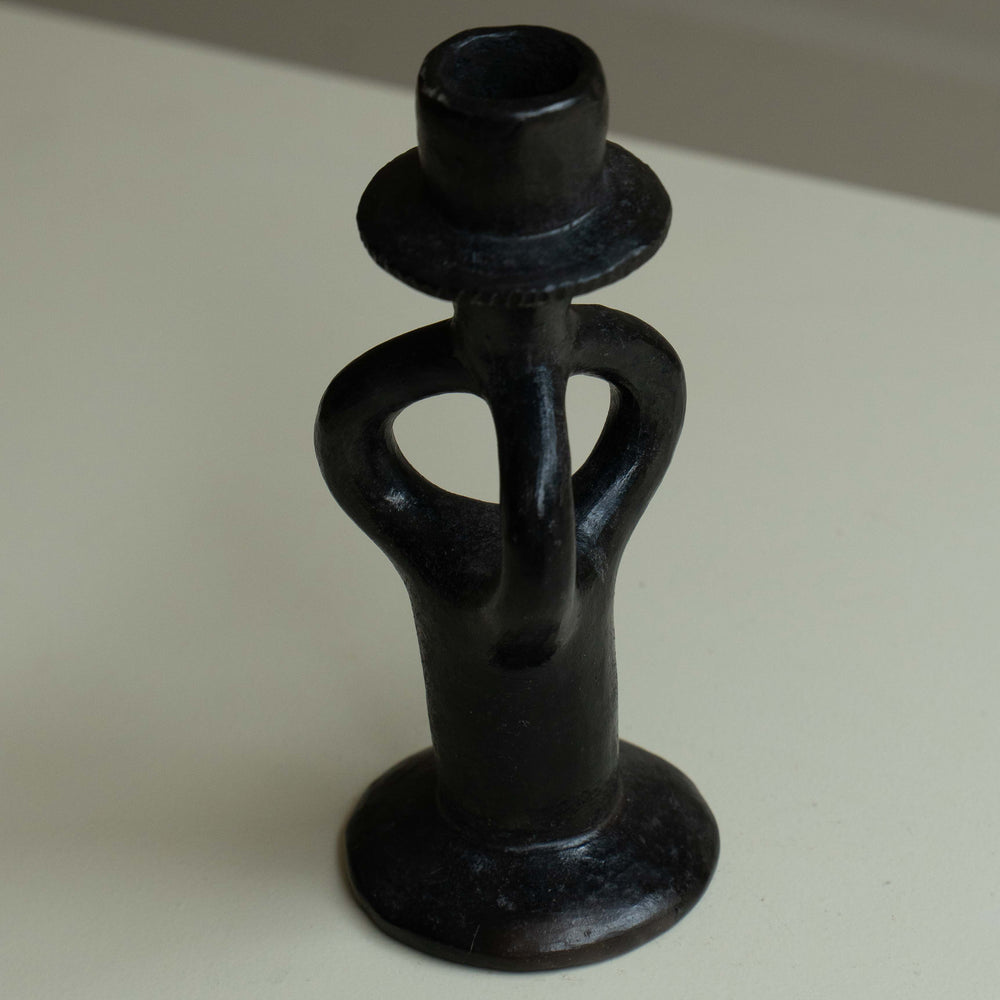 
                      
                        Pair of wrought iron candle holders
                      
                    