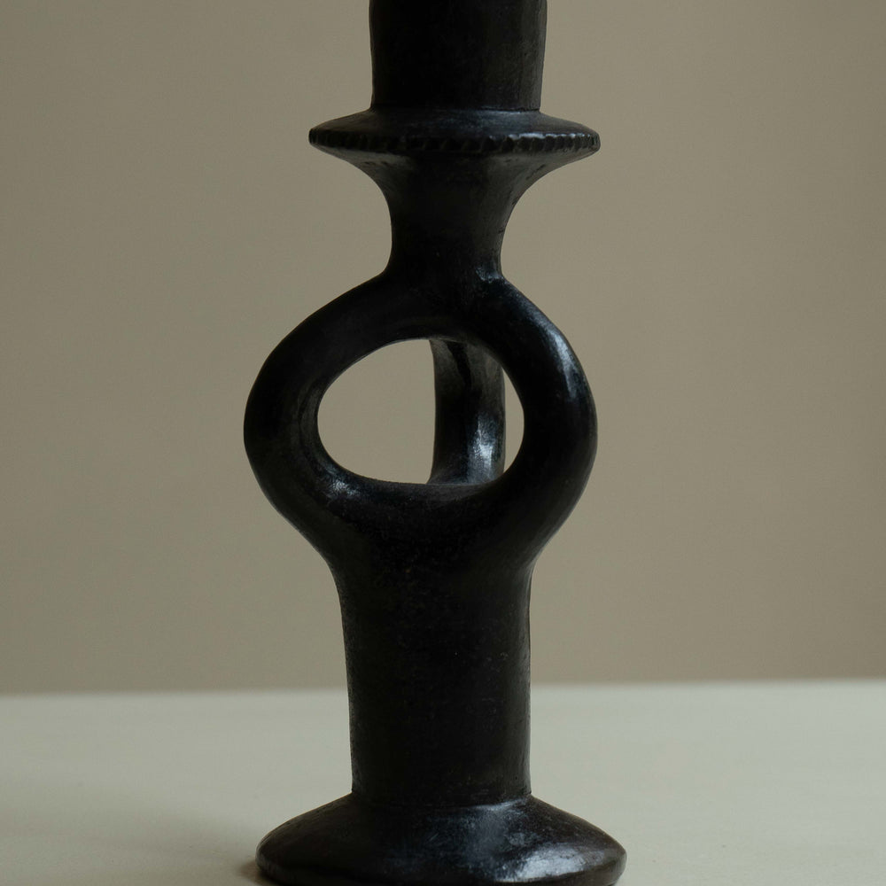 
                      
                        Pair of wrought iron candle holders
                      
                    