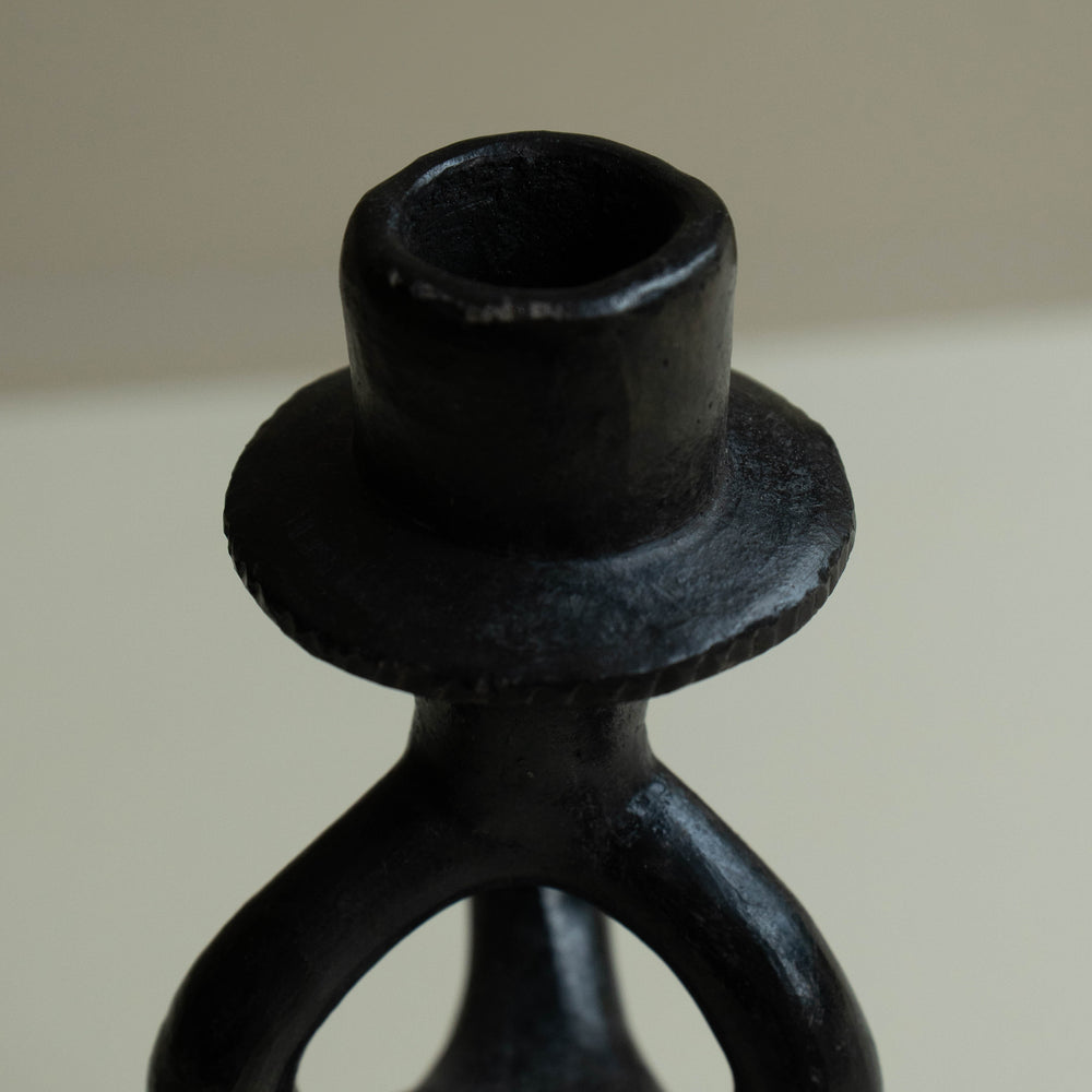 
                      
                        Pair of wrought iron candle holders
                      
                    