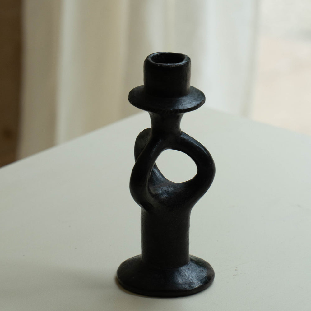 
                      
                        Pair of wrought iron candle holders
                      
                    